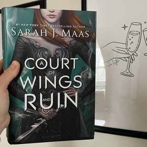 The original hard back cover of A Court of Wings and Ruin!